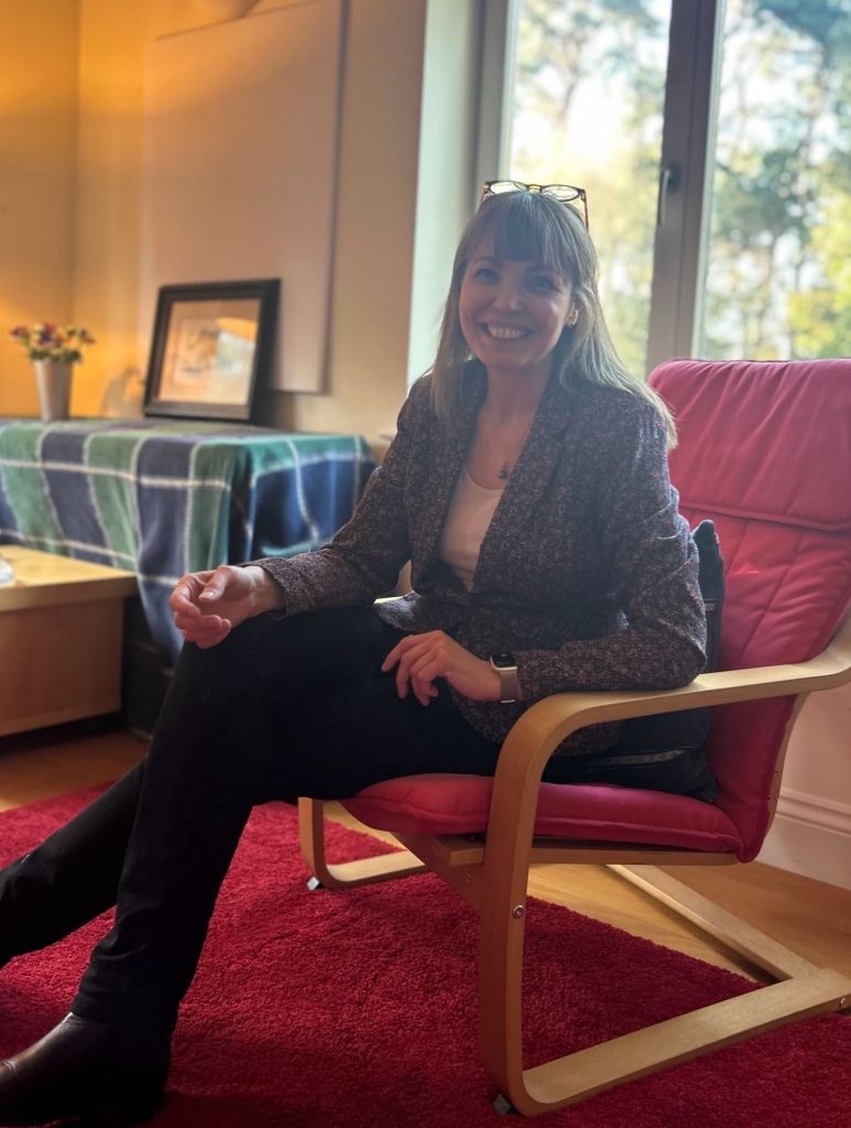 Florence Little in a chair.